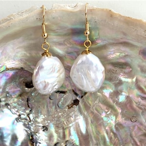 elegant earrings made of flat-round Keshi baroque cultured pearls 23x19x5mm