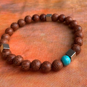 Bracelet wooden beads (dragon tree) in really beautiful grain 8 mm, real turquoise 8 mm, stainless steel cube :-)