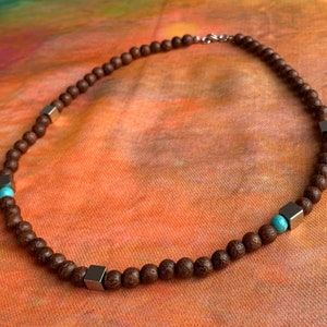 Necklace wooden beads 6 mm (dragon tree) in really beautiful grain, turquoise jasper beads 6 mm, stainless steel cube :-)