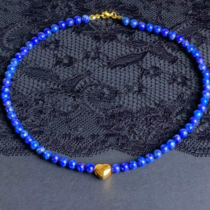 Lapis lazuli AB 6 mm beads round (naturally undyed) with gold-plated heart as a necklace :-)