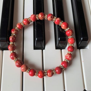 red Imperial Jasper, elastic bracelet made of 8 mm beads with rhinestones