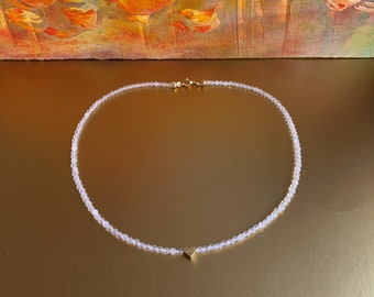 Rock crystal, necklace made of faceted pearls 3 mm with a delicate golden heart
