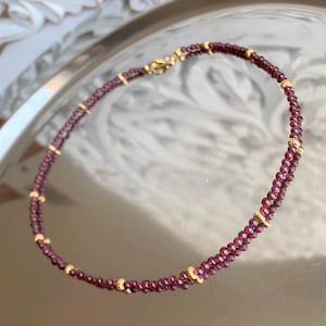 red garnet, necklace made of round pearls 3 mm (without facets) with small golden pearls - magical play of light ;-)