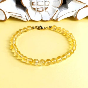 Bracelet: Citrine in A-quality, clear round beads 6 mm (undyed!)