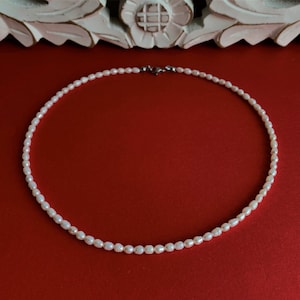 Necklace made of white cultured pearls 5~6.5x3.5~4 mm class *AAA* with a remarkably brilliant luster