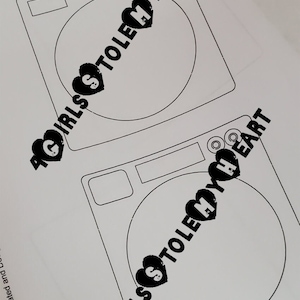 May include: Two black and white illustrations of washing machines with the text "Girls Stole My Heart" printed on each.