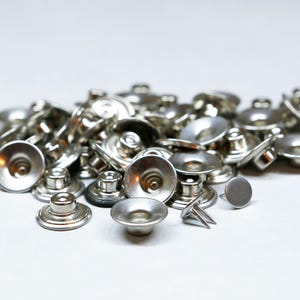 YKK metal button  silver 12 pieces make in USA sever