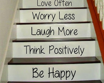 May include: White painted wooden stairs with black text on each step. The text reads: Enjoy Life, Exercise Daily, Eat Healthy, Work Hard, Stay Strong, Love Often, Worry Less, Laugh More, Think Positively, Be Happy.