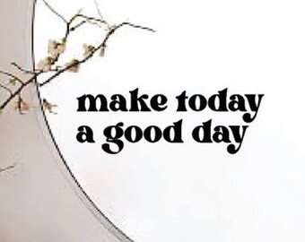 May include: A round mirror with a silver frame and the text "make today a good day" in black lettering.