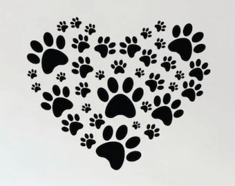 May include: Black paw print decals arranged in the shape of a heart on a white wall. The paw prints are various sizes and are a popular choice for pet lovers.