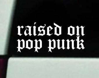 May include: White vinyl decal with the text "raised on pop punk" in a gothic font.
