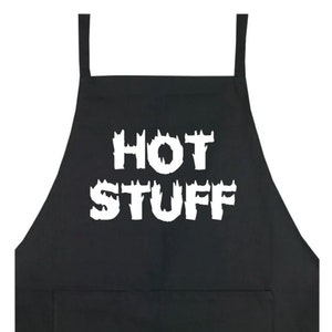 May include: Black apron with a white pocket and the text "HOT STUFF" in a flame font.