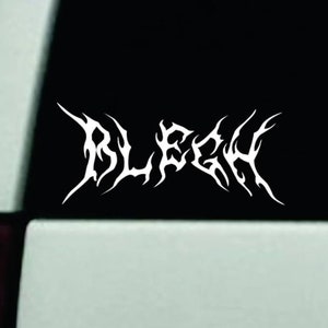 May include: White decal with the word "BLEGH" in a stylized, gothic font. The decal is displayed against a black background, likely on a vehicle. The font has sharp, pointed edges.