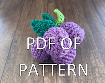 May include: A crocheted grape cluster with green leaves. The text "PDF of PATTERN" is written below the grape cluster.