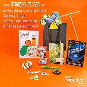 The image is an advertisement for a Bamboo Flyer, which is included in a pre-filled Science bag. The Bamboo Flyer is accompanied by various science-related items such as a Bamboo Flyer, a 3D printer, and a science experiment kit. The image also includes a Bamboo Flyer, a science experiment kit, and a science experiment kit.