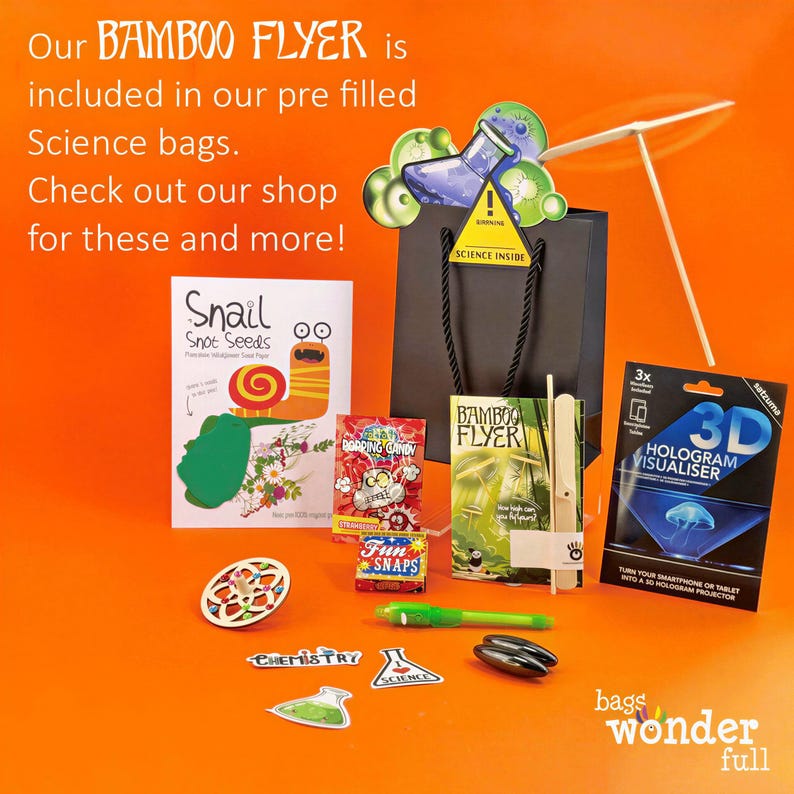 The image is an advertisement for a Bamboo Flyer, which is included in a pre-filled Science bag. The Bamboo Flyer is accompanied by various science-related items such as a Bamboo Flyer, a 3D printer, and a science experiment kit. The image also includes a Bamboo Flyer, a science experiment kit, and a science experiment kit.