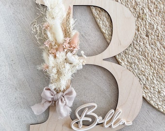 Wooden letter with dried flowers