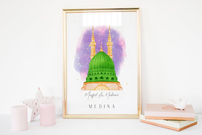 May include: A watercolor illustration of the Masjid an Nabawi mosque in Medina, Saudi Arabia. The mosque has a green dome and two minarets. The background is a purple watercolor wash with gold stars.