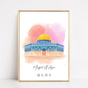 May include: A watercolor painting of the Dome of the Rock mosque in Jerusalem. The mosque is depicted in blue and gold with a pink and white watercolor background. The text "Masjid Al Aqsa" and "Quds" is written below the mosque.