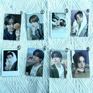 May include: Eight photo cards displaying images of a person in different poses and outfits. The cards are rectangular, with diverse backgrounds and styles, including some in a polaroid format. The person is wearing a variety of clothing, with different expressions.