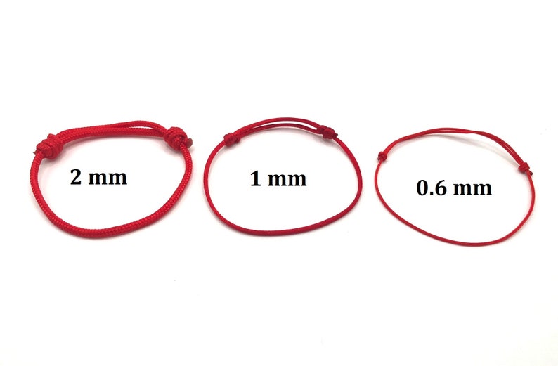 May include: Three red cords of different thicknesses, 0.6 mm, 1 mm, and 2 mm, are shown on a white background. The cords are tied in a simple knot at each end.