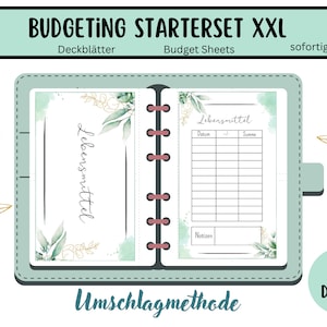May include: A green and gold budget planner with the text "BUDGETING STARTERSET XXL" and "Lebensmittel" (German for "groceries") on the cover. The planner is a binder with a ring mechanism and includes 190+ pages.