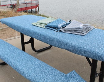 Juego de mantel y fundas para bancos de picnic azules con cierre seguro y bolsa de almacenamiento.