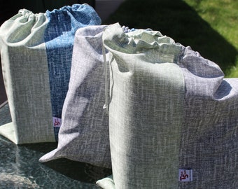 Bolsa de transporte y almacenamiento bicolor de 35,5 cm de ancho x 44,5 cm de alto con doble cordón ajustable.