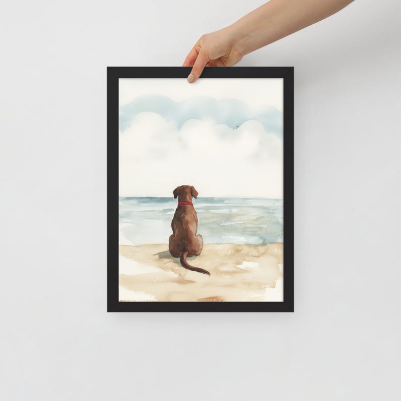 May include: Watercolor painting of a brown dog sitting on a beach, looking out at the ocean. The dog has a red collar and is facing away from the viewer.