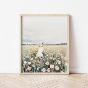 May include: A white dog sits in a field of pink and white flowers. The dog is looking away from the camera. The background is a soft blue sky.