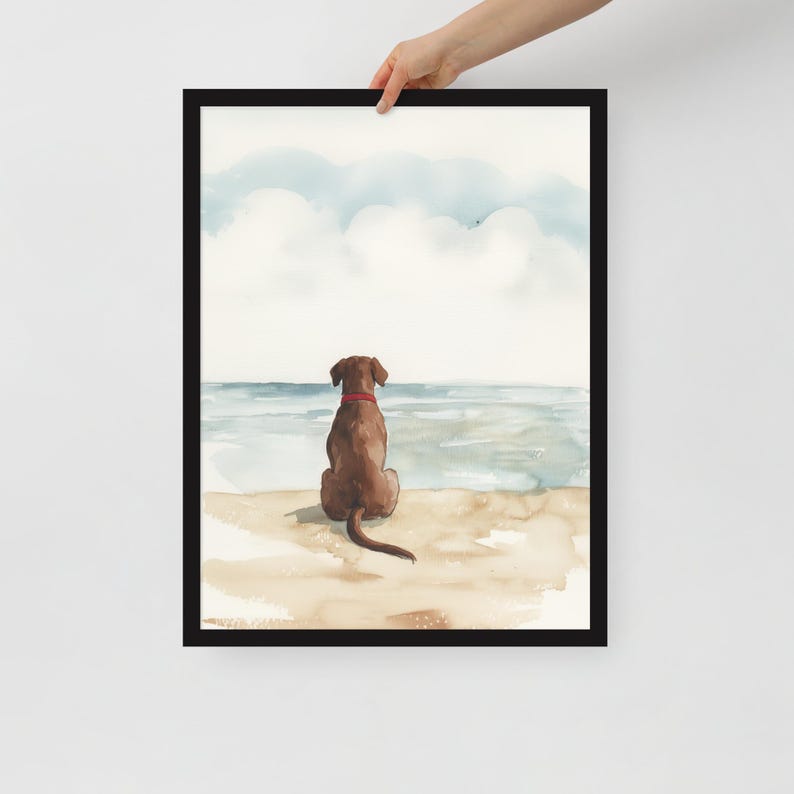 May include: Watercolor painting of a brown dog sitting on a beach, looking out at the ocean. The dog has a red collar and is facing away from the viewer. The sky is blue with white clouds.