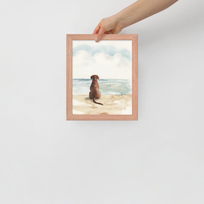 May include: A watercolor painting of a brown dog sitting on a beach, looking out at the ocean. The dog has a red collar and a long tail. The sky is blue with white clouds. The water is blue and green.