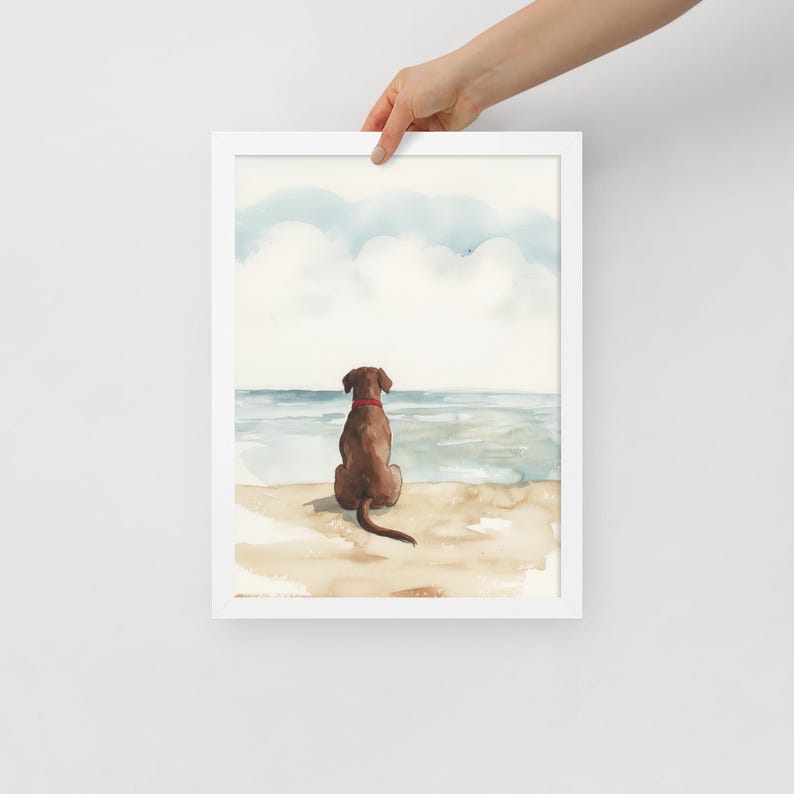 May include: Watercolor painting of a brown dog sitting on a beach looking out at the ocean. The sky is blue with white clouds.