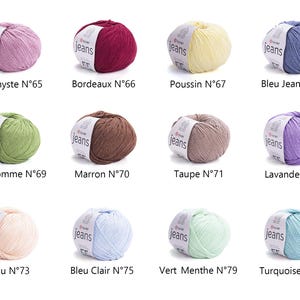 May include: A collection of twelve balls of yarn in various colors, including pink, burgundy, yellow, blue, green, brown, and purple. Each ball has a label that reads "jeans" and a number. Ideal for knitting and crochet projects.