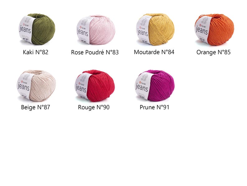 May include: A collection of eight yarn balls in various colors, including green, pink, yellow, orange, beige, red, and purple. Each ball has a label that reads "jeans" and a number. The colors are labeled as Kaki, Rose Poudr&eacute;, Moutarde, Orange, Beige, Rouge, and Prune.