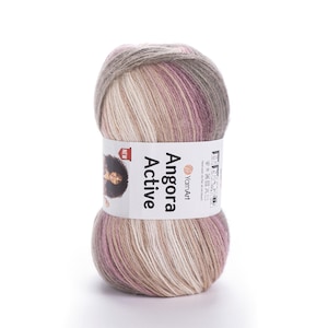 Può includere: Gomitolo di filato Angora Active nei toni del beige, rosa e grigio. L'etichetta bianca riporta "Angora Active" e presenta l'immagine di una donna. Adatto per lavori a maglia e uncinetto.