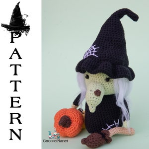 May include: Crocheted witch doll with a black hat, white hair, and a green face. The doll is holding a crocheted orange pumpkin. The doll is sitting on a green background.