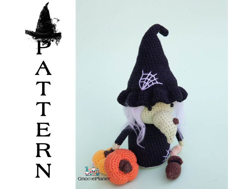 May include: Crocheted witch doll with a black hat, white hair, and a long nose. The doll is holding a pumpkin and an acorn. The doll is standing on a light green background. The word "PATTERN" is written vertically in black letters on the left side of the image.