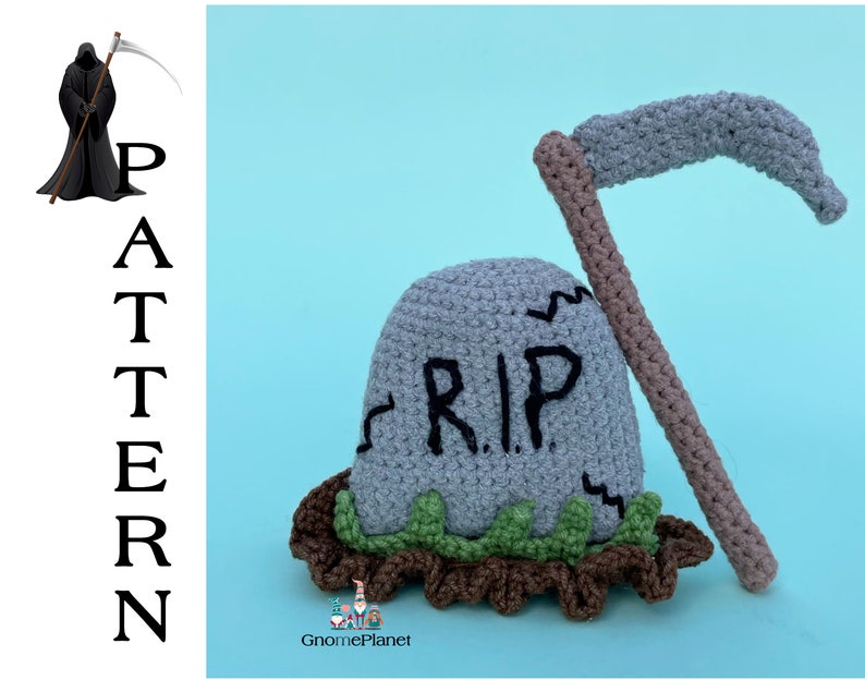 May include: A crocheted gray tombstone with the words "RIP" on it, a brown crocheted scythe, and green crocheted grass.