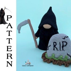 May include: Crocheted amigurumi Grim Reaper doll wearing a black robe and holding a scythe. The doll is standing next to a gray crocheted tombstone with the inscription "R.I.P."