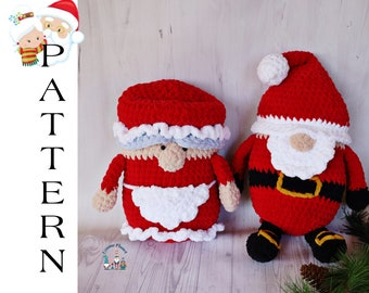 May include: Two crocheted Christmas gnomes, one resembling Santa Claus and the other Mrs. Claus. The Santa gnome is red with a black belt and yellow buckle, black boots, and a white beard. The Mrs. Claus gnome is red with a white apron and blue trim.