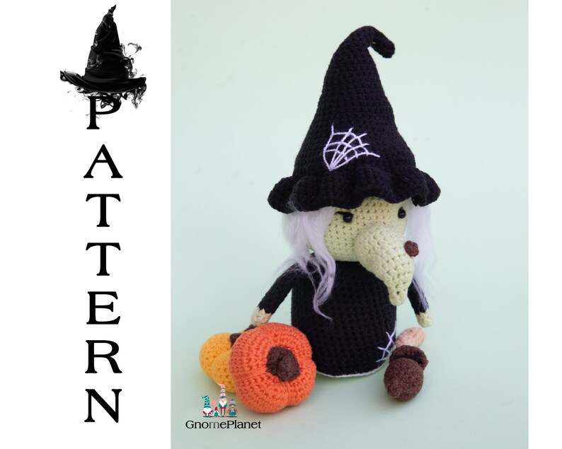 May include: Crocheted witch doll with a black hat, white hair, and a green face. The doll is holding a small orange pumpkin and is standing on a green background. The doll is wearing a black dress and has a spiderweb on her hat. The doll is part of a crochet pattern by GnomePlanet.