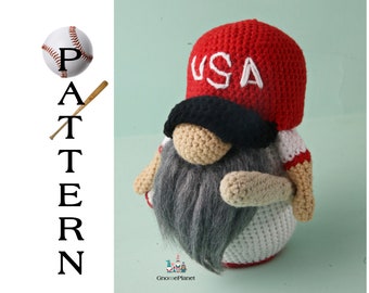 May include: Crocheted gnome wearing a red baseball cap with "USA" embroidered on the front, a black eye patch, and a white and red striped shirt. The gnome is holding a brown baseball bat.