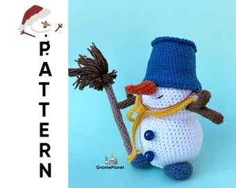 May include: A crocheted snowman wearing a blue hat, a yellow scarf, and brown mittens. The snowman is holding a brown broom and has a carrot nose. The snowman is standing on a blue background.
