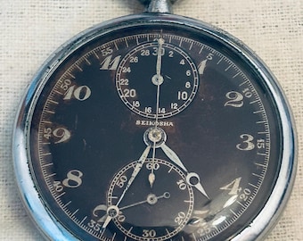 Seikosha WWII Japanse luchtmacht chrono stopwatch Konica machinegeweer camera