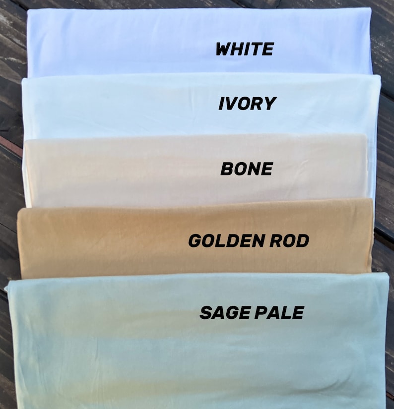 May include: Five fabric swatches in different shades of white, ivory, bone, golden rod, and sage pale. The swatches are labeled with their respective colors.