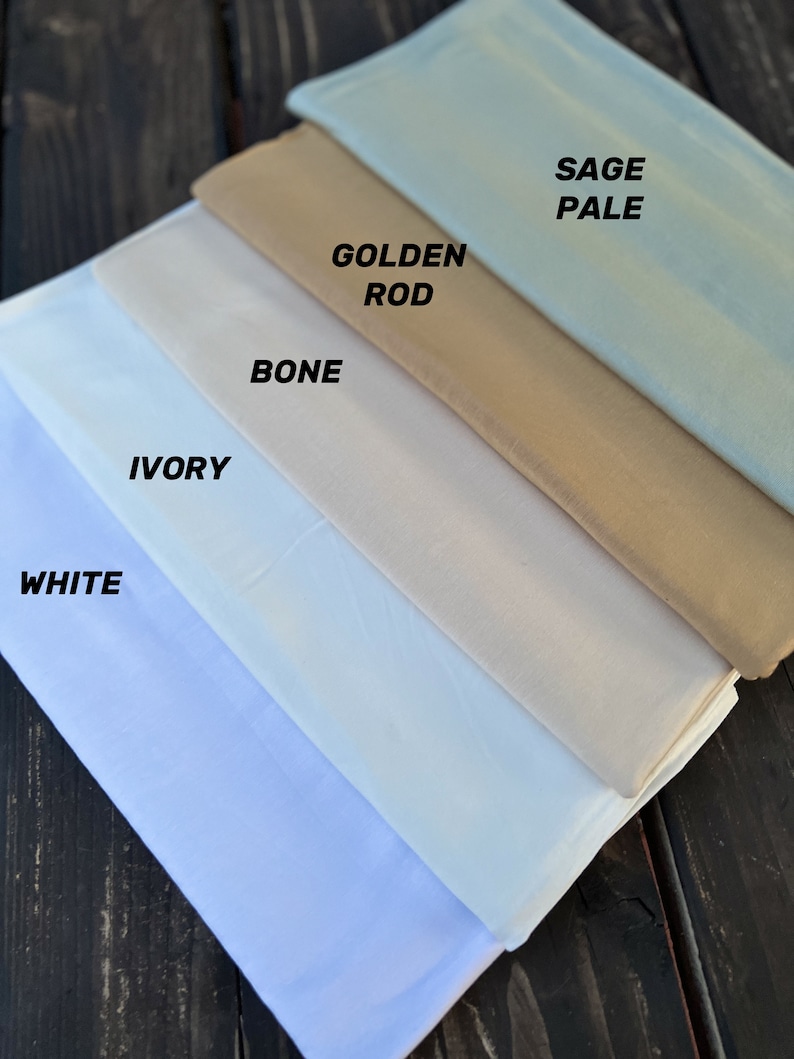 May include: Five fabric swatches in different shades of white, cream, and beige. The swatches are labeled from lightest to darkest: White, Ivory, Bone, Golden Rod, and Sage Pale.