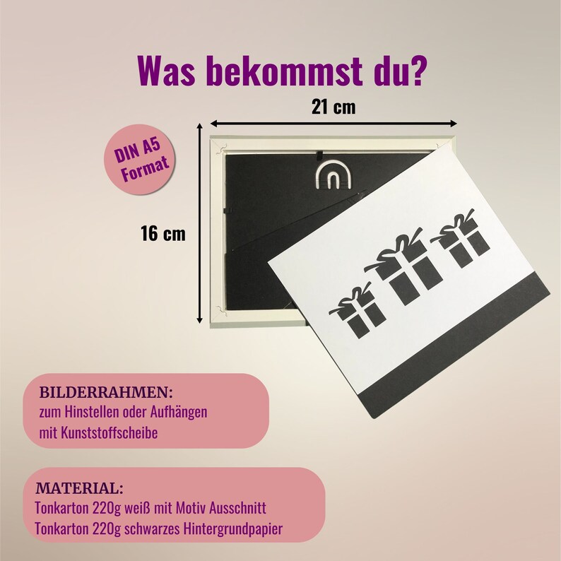 May include: A white picture frame measuring 21 cm by 16 cm, labelled DIN A5 format. It includes a white card with three black gift box cutouts and a black backing sheet. Text includes 'Was bekommst du?', 'BILDERRAHMEN', and 'MATERIAL'.
