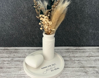 A small gift, a little something for a woman's birthday, giving flowers, decorating the living room, taking time to be happy