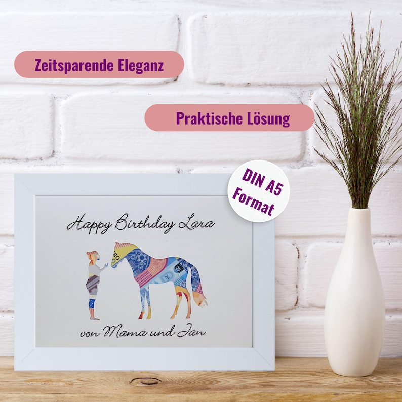 May include: A white framed print in DIN A5 format featuring a graphic of a person standing next to a horse, both filled with a colourful patterned design. The text reads Happy Birthday Lara and von Mama und Jan. Above are labels Zeitsparende Eleganz and Praktische L&ouml;sung.